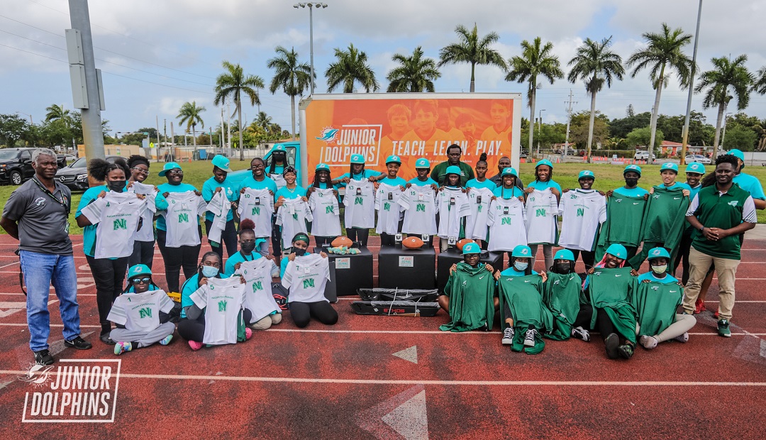 Junior Dolphins Surprise North Miami Girls Flag Football with Equipment Donation 